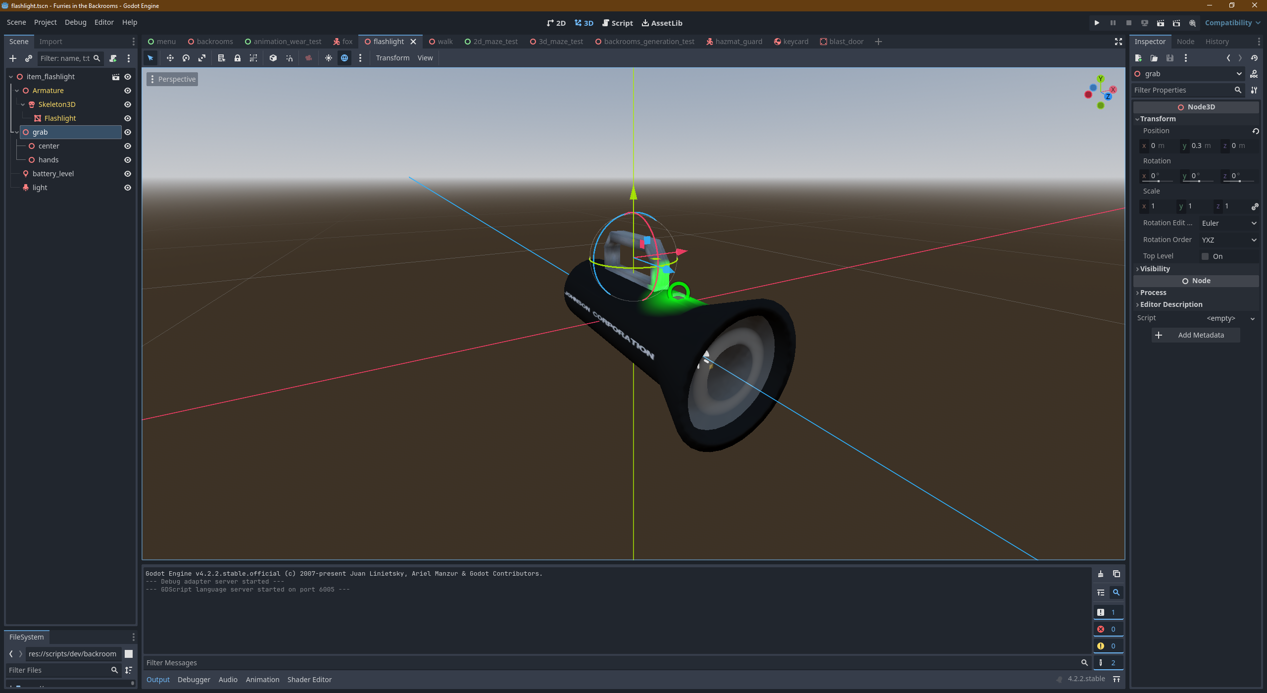 A big black flashlight with a handle in the Godot engine editor.
There is a power level on top of it with green light.
We can read the white text "JOHNSON CORPORATION" on the left side of the flashlight.